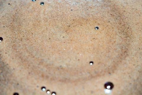 Aromatic coffee foam texture background with small bubbles and drops Stock Photos