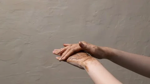 Aromatic coffee scrub gently exfoliates hands, revealing soft skin, in a sp.. Stock Footage 304213385