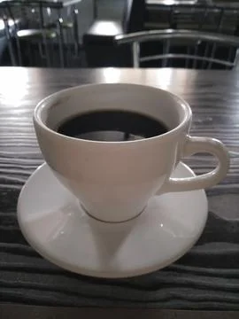 Aromatic coffee in a white cup close up Stock Photos