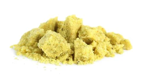 Aromatic crumbled bouillon cube on white background Stock Photos
