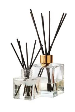 Aromatic diffuser bottle with sticks isolated on white background Foto stock