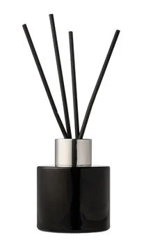 Aromatic diffuser bottle with sticks isolated on white background Foto stock