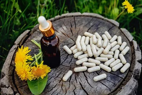Aromatic essential oils with white chalk on wooden table Stock Photos