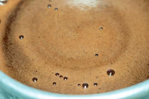 Aromatic freshly brewed dark espresso coffee surface with rich crema 스톡 사진