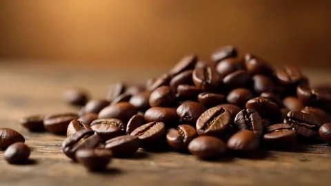 Aromatic Freshly Roasted Coffee Beans Pile Close-Up on Wooden Table Surface Stock Footage 308135238