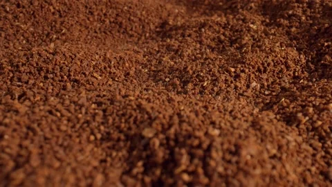 Aromatic ground coffee is scattered on the surface of the table. The concept of Stock Footage 165191559