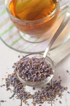 Aromatic lavender tea and bunch of dried lavender. Toned image Stock Photos