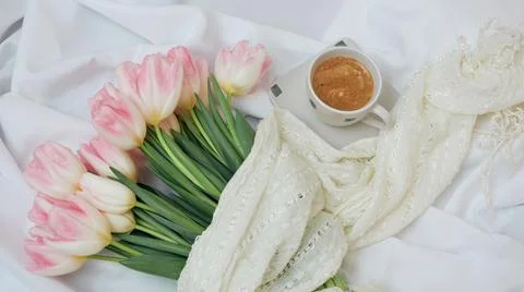 Aromatic morning coffee in a ceramic white cup. Big beautiful bouquet of spri Stock Photos