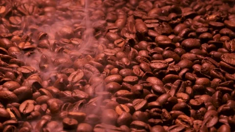 Aromatic smoke comes out from roasting coffee. Stock Footage 168163387
