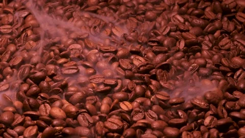 Aromatic smoke comes out from roasting coffee. Stock Footage 168396040