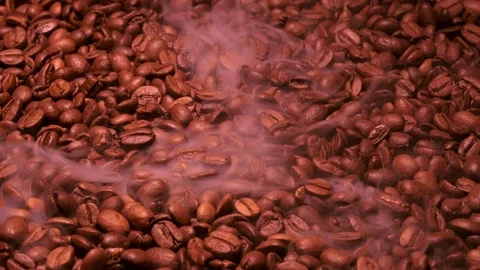 Aromatic smoke comes out from roasting coffee. Stock Footage 168747196
