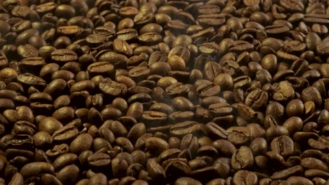 Aromatic smoke comes out from roasting coffee. Stock Footage 171760985