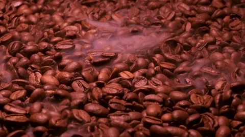 Aromatic smoke comes out from roasting coffee. Stock Footage 172565873
