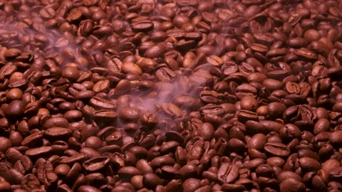Aromatic smoke comes out from roasting coffee. Stock Footage 173677010