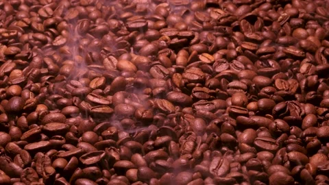 Aromatic smoke comes out from roasting coffee. Stock Footage 175556372