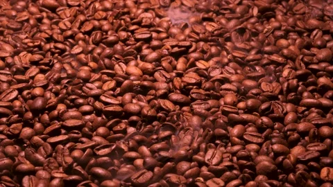 Aromatic smoke comes out from roasting coffee. Stock Footage 177411361