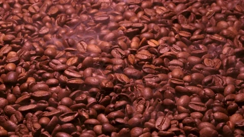 Aromatic smoke comes out from roasting coffee. Stock Footage 181316254
