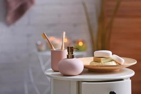 Aromatic soap and shampoo on table against blurred background. Space for text Foto stock