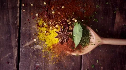 Aromatic Spices Falling on a Wooden Spoon Stock-Footage 333738629