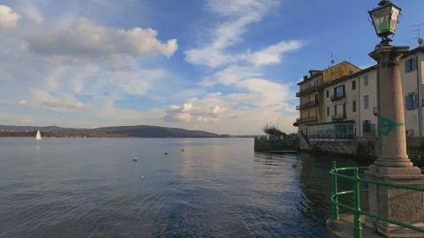 Arona town overlooking lake maggiore in italy. panning view Stock-Footage 279891853