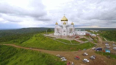 Around aerial panorama of white monastery on hill and territorial in cloudy day 스톡 동영상 80282092