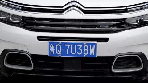 Around the front of a white SUV Stock Footage 157532265