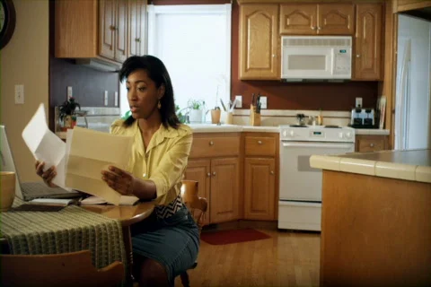 Around The House: Paying The Bills 01 (480p / 29.97) Stock Footage