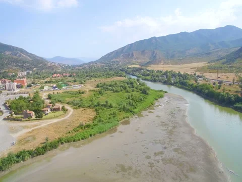 Around panorama town with red roofs and large church in center near  river 스톡 동영상 80306790
