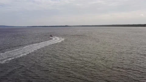 Around small motor boat on surface of Jervis bay in Australia – aerial 4k. Stock Footage 171776015