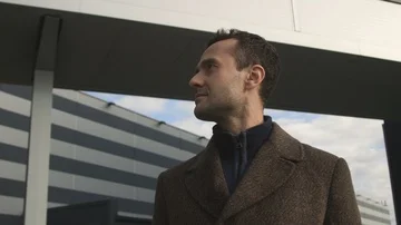 Around the stylish modern man looking ahead standing at the business center Stock Footage 85665009