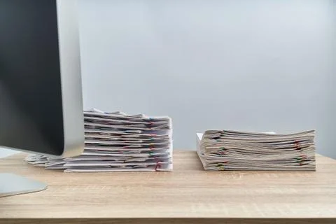 Arrange pile overload document report and computer on wooden table Stock Photos