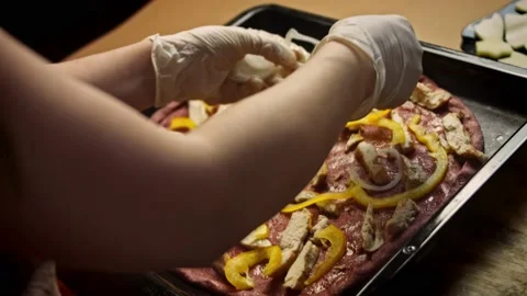 Arrange the white onion over the red pizza dough. Tasty Recipe Red Pizza for New Stock Footage 156756650