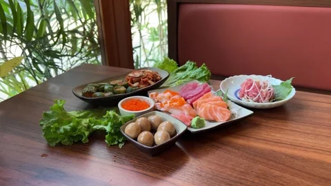 Arranged sushi platter served on elegant multi-tiered display stand. Vibrant Stock Footage 322097753