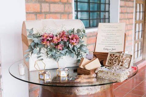 Arranged wedding reception table, white decorative box adorned with flowers.. Stock Photos