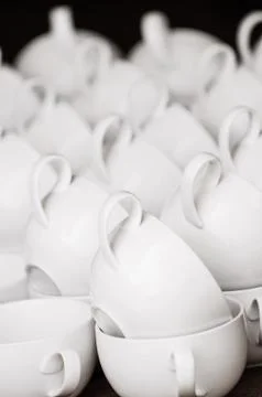 Arranged white coffee cups in pattern, ready for morning coffee Stock Photos