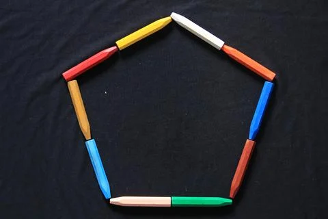 The arrangement of crayons forms an artistic space Stock Photos