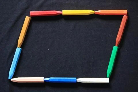 The arrangement of crayons forms an artistic space Stock Photos