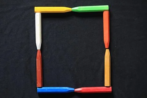 The arrangement of crayons forms an artistic space Stock Photos