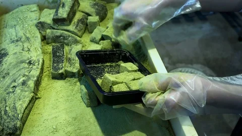 Arrangement of cubes warabimochi squares shape into plastic box Stock Footage 84876891