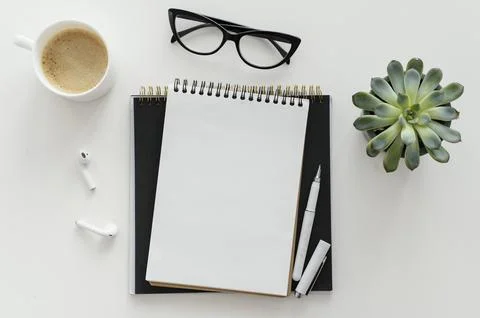 Arrangement with empty notepad desk 写真素材
