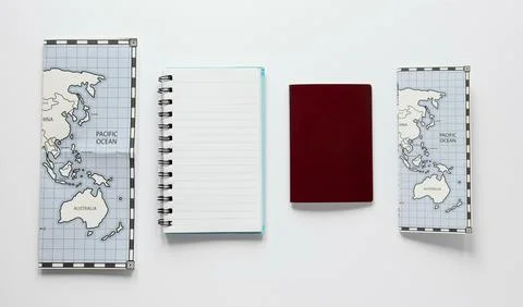 Arrangement with notebook and maps Stock Photos