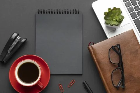 Arrangement office elements dark background with notepad 写真素材