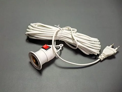 Arrangement of white electrical components includes a light bulb socket wit.. Stock Photos