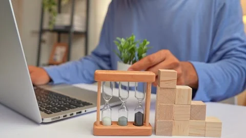 Arranging blocks into steps and topping them with a plant. Stock Footage 316568096