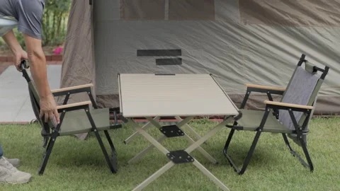 Arranging Camping Chairs in a Backyard Stock-Footage 346534133