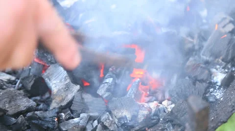 Arranging coals Stock Footage 22678724