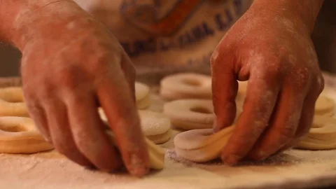 Arranging donuts for subsequent frying Stock Footage 130086741