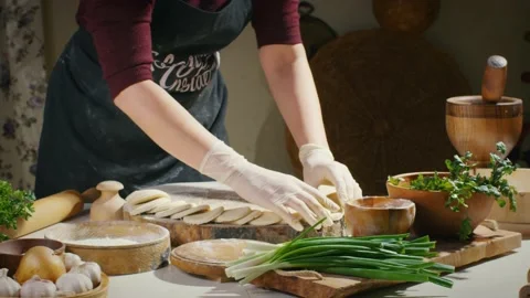 Arranging dough circles on table Stock Footage 138126478