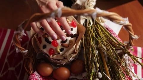 Arranging Easter Basket With Bread and Eggs Stock Footage 346064492