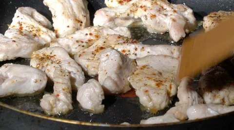 Arranging meat on a frying pan Stock Footage 58822065